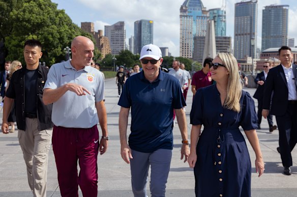 Prime Minister Anthony Albanese and his fiancee, Jodie Haydon, walk along the Bund with former Socceroo and Shanghai Port FC Manager Kevin Muscat in Shanghai.