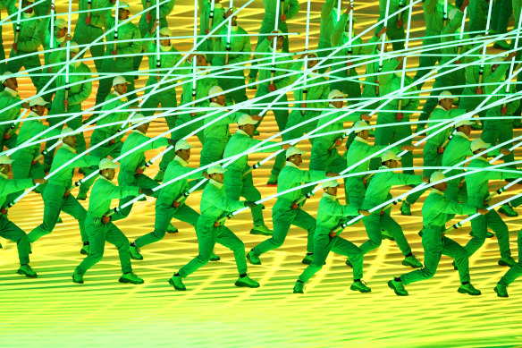 Performers create a flower display with LED lights during the opening ceremony.