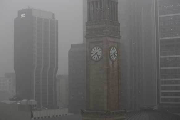 Heavy rain hits Brisbane CBD as storms sweep across south-east Queensland.