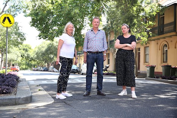 Millers Point residents Margaret Wright, left, Bernard Kelly, and Yasmina Bonnet on Kent Street, along which the cycleway was to have been built.