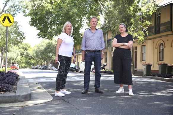 Millers Point residents Margaret Wright, left, Bernard Kelly, and Yasmina Bonnet on Kent Street, along which the cycleway was to have been built.
