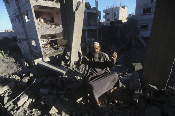 A Palestinian reacts after an Israeli strike on residential buildings in Rafah.