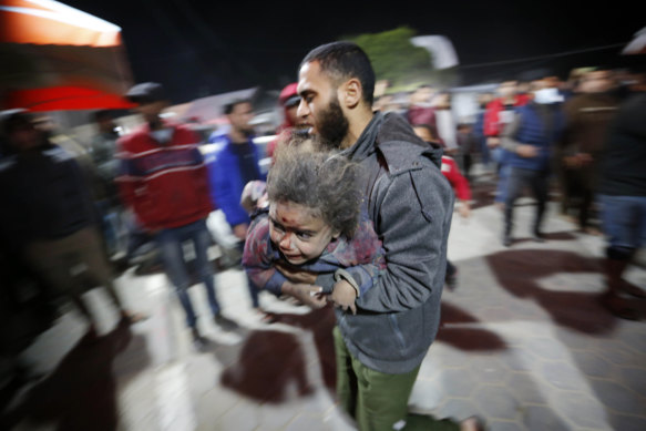 Palestinian child wounded by Israeli attack is brought to Al-Aqsa hospital in Deir el-Balah, central Gaza, on Tursday.