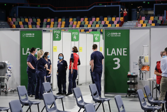 Staff at the Brisbane Entertainment Centre mass vaccination hub at Boondall, in the city’s north.