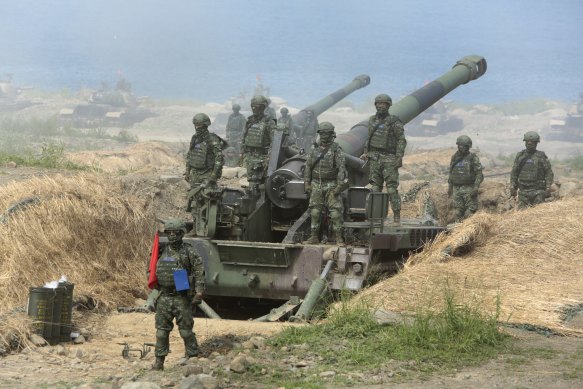 Taiwanese forces conducting an anti-invasion drill on a beach.