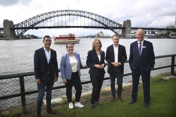 Sydney MP Alex Greenwich, left, North Shore MP Felicity Wilson, Metropolitan Roads Minister Natalie Ward, Heritage Minister James Griffin and Transport NSW chief operating officer Howard Collins detail the 90th anniversary celebrations.