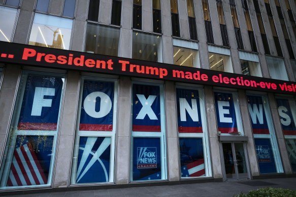 A headline about former president Donald Trump is displayed outside Fox News studios in New York on November 28, 2018.