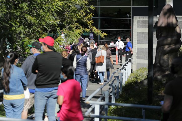 Lines at the Queensland government’s second largest COVID vaccination hub at the Logan Entertainment Centre on Thursday, which is currently administering about 1500 doses a day. 