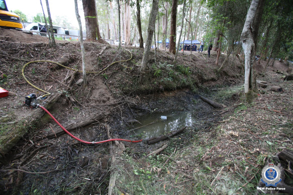 Police pump the creek on the fifth day of the search