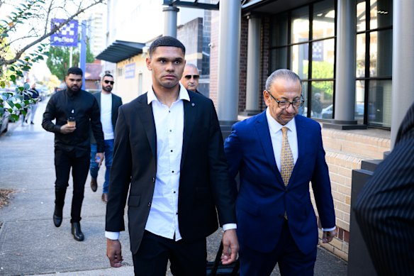 South Sydney Rabbitohs NRL player Tyrone Munro (left) arrives at Burwood Local Court.