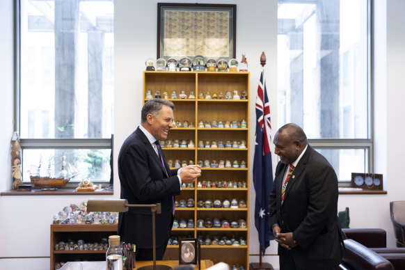 Richard Marles displays his extensive snow globe collection to Papua New Guinea Prime Minister James Marape.