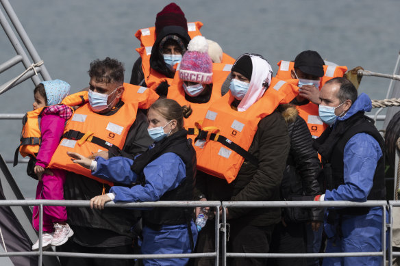 Migrants arrive at Dover, England, after being picked up in the Channel by the British border force on Thursday.