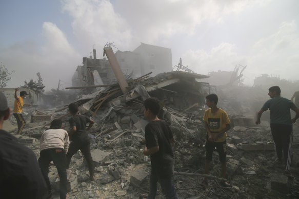 Palestinians look for survivors in buildings destroyed in the Israeli bombardment of the Gaza Strip.