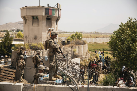 US Marines assist with security at an evacuation control point at Hamid Karzai International Airport in Kabul.