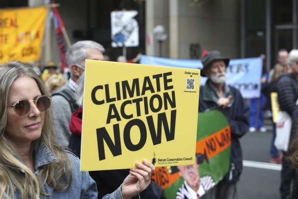 Climate activists demonstrate in front of State Parliament House.