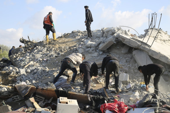 Palestinians search for survivors after an Israeli airstrike on a residential building In Rafah, Gaza on Saturday.