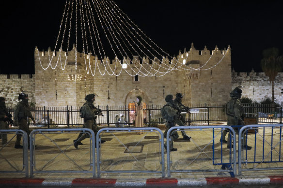 Israeli police officers deploy during clashes with Palestinian protesters next to Damascus Gate in Jerusalem’s Old City on Friday.