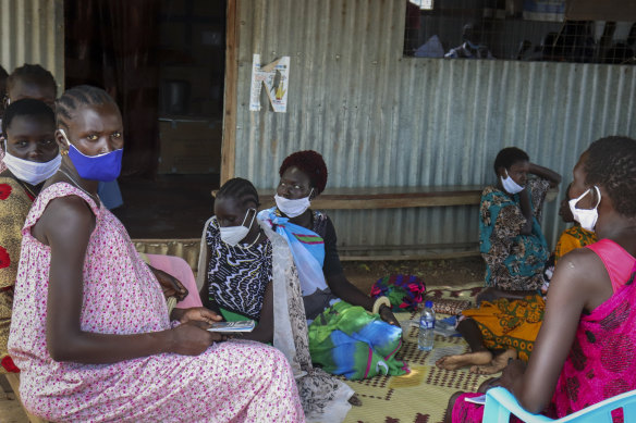 Expectant mothers sit on the floor awaiting a monthly check-up at the Mingkaman Reproductive Health Clinic in the village of Mingkaman, in the Lakes State state, South Sudan.