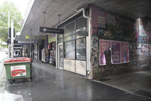 Abandoned and unleased shopfronts line Oxford Street in Darlinghurst.