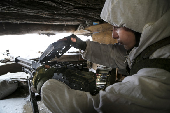 A serviceman checks his machinegun in a shelter on the territory controlled by pro-Russian militants in the Luhansk region of eastern Ukraine.