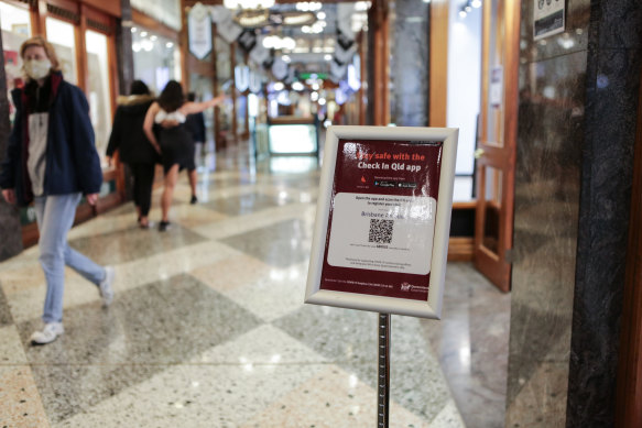 Check In Qld QR codes at the entrance to Brisbane Arcade in the CBD after an expansion of the platform’s mandatory use from July 9.