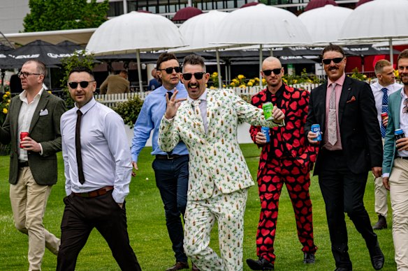 Dylan “Honky” Nicholson, middle, and his friend Matt Notman, second from right, at Flemington racecourse.