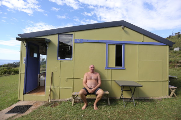 Gary McKenzie outside his shack at Little Garie Beach. His grandmother bought it in 1951, and it has survived a range of threats. 