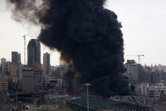 Smoke rises from a huge fire that broke out at Beirut's port on Thursday.