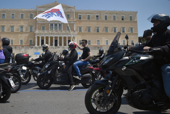 Tourism and delivery workers take part in a motorbike protest for International Memorial Day in front of the Greek Parliament on April 28 in Athens. The country is in coronavirus lockdown.