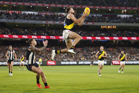 Noah Balta of the Tigers marks the ball.
