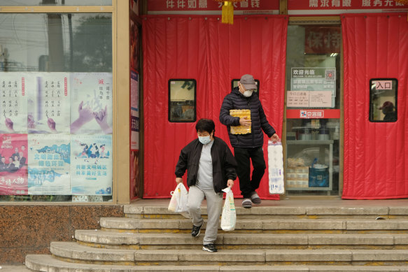 Shoppers in Beijing have been stockpiling essential items. 