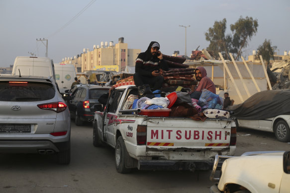 Palestinians fleeing the Israeli bombardment of the Gaza Strip arrive in Rafah, near the border with Egypt.
