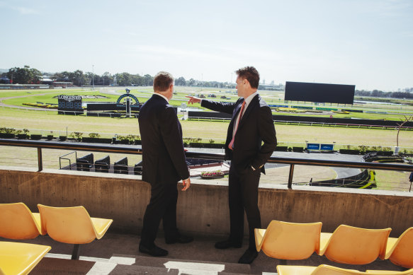 Premier Chris Minns with Australian Turf Club chair Peter McGauran at Rosehill in 2023 when the pair announced the new mini-city.