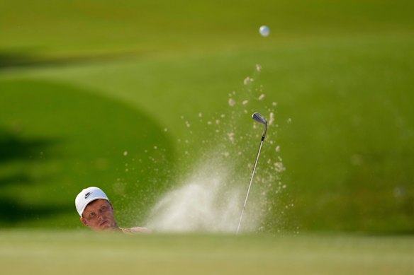 Cameron Davis hits from the bunker on the eighth hole at the Quail Hollow Club.
