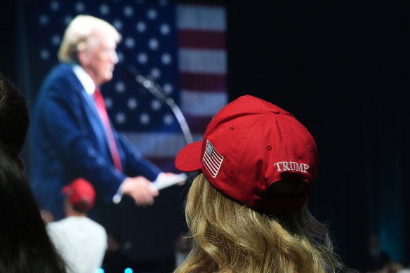 A supporter watches as the Republican presidential candidate, former president Donald Trump, speaks in Florida.