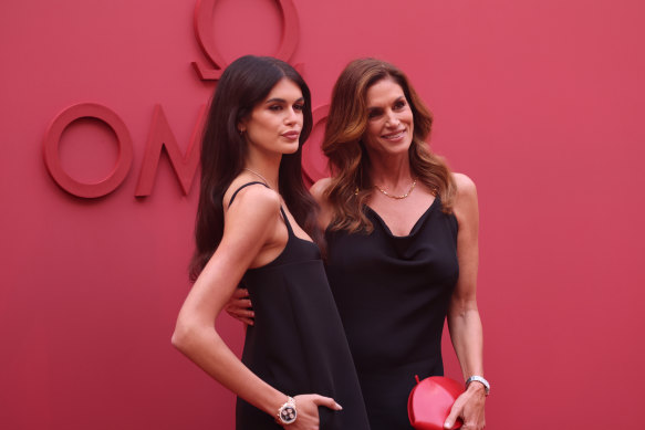 Mother-daughter supermodels and brand ambassadors Kaia Gerber and Cindy Crawford attend the opening night of Omega House Paris 2024. 