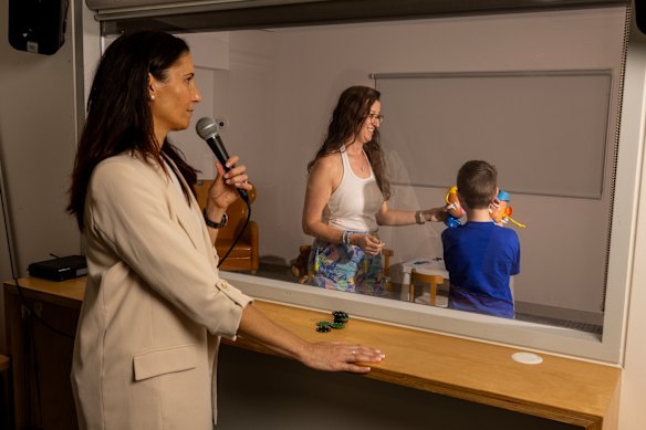 UNSW Professor Eva Kimonis coaching Erin Stevenson and her son, Micah, at a Parent-Child Interaction Therapy clinic.