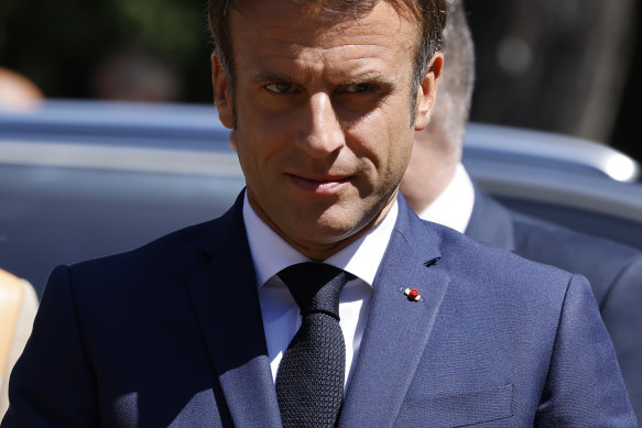 French President Emmanuel Macron arrives to vote in the first round of parliamentary elections on Sunday.