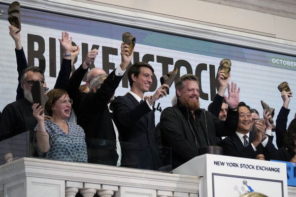 Wave your sandals: Birkenstock CEO Oliver Reichert, second from right, rings the New York Stock Exchange opening bell, prior to the shoemaker’s trading debut.