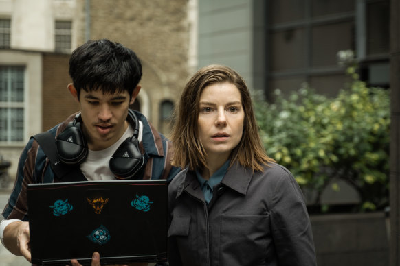 Hacker Roddy Ho (Christopher Chung) on the job with Shirley Dander (Aimee-Ffion Edwards) in Slow Horses.