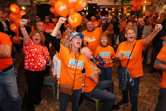 One Nation supporters cheers as David Farley wins the by-election in Albury. 