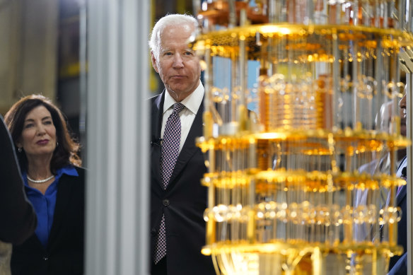 Biden looks at the IBM System One quantum computer with New York Gov. Kathy Hochul during a tour of an IBM facility in Poughkeepsie, NY