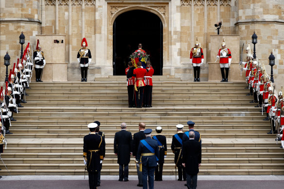 The coffin is carried into St George’s Chapel.