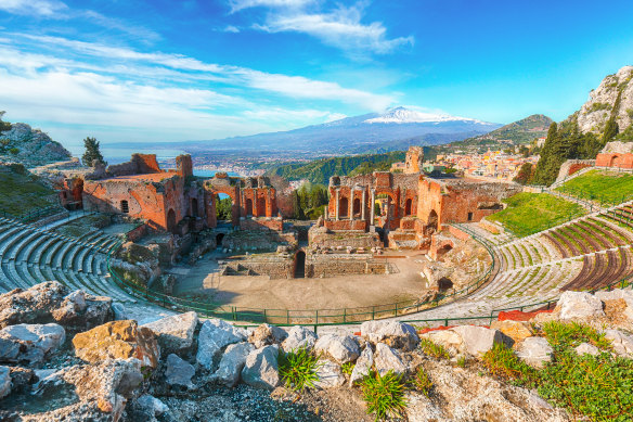 The amazing Greek theatre in Taormina offers views out to Mount Etna.