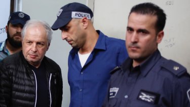 Bezeq telecom company's controlling shareholder Shaul Elovitch arrives to the magistrate court in Tel Aviv last month.