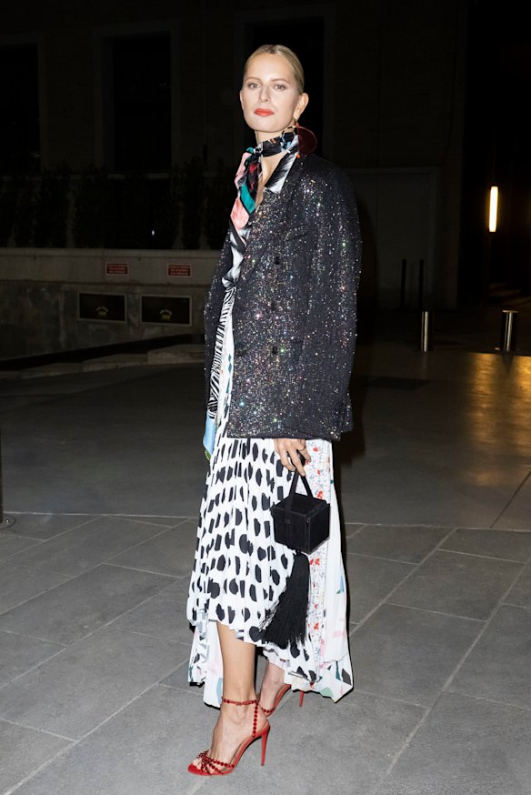 Fringe benefits ... Karolina Kurkova in Milan with one of the season's hottest trends on her arm.