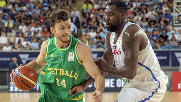 Hard yards: Boomer Angus Brandt takes on Philippines’ Andray Blatche at Margaret Court Arena.