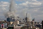 Smoke rises after co-ordinated US and Israeli airstrikes in Tehran, Iran.