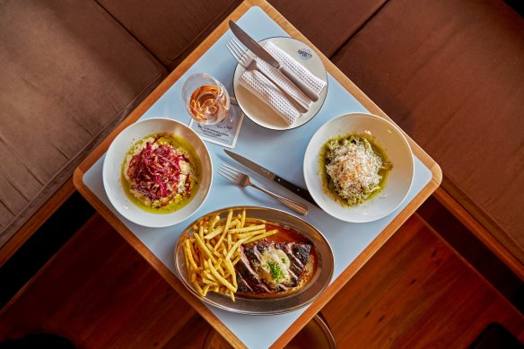 Steak frites and assorted dishes. 