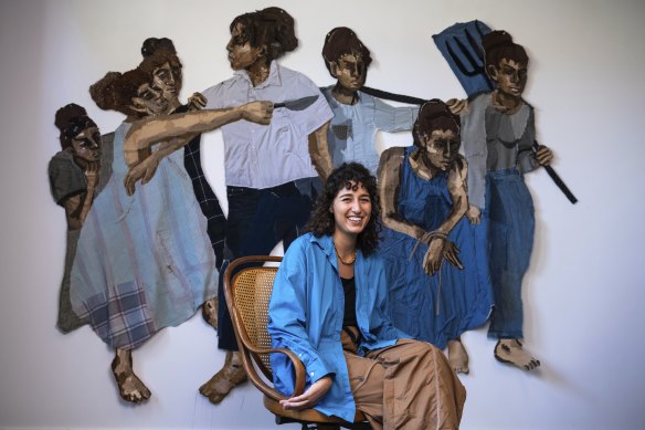 Julia Gutman with her work, Everyone You Are Looking at is Also You.